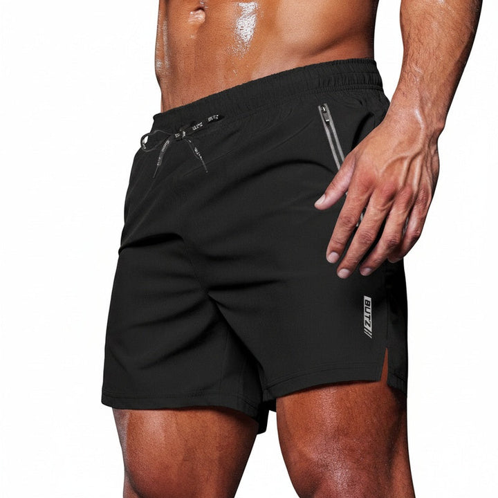 Heren sportshorts met elastische taille en ritszakken. Ideaal voor gym, training of fitness.