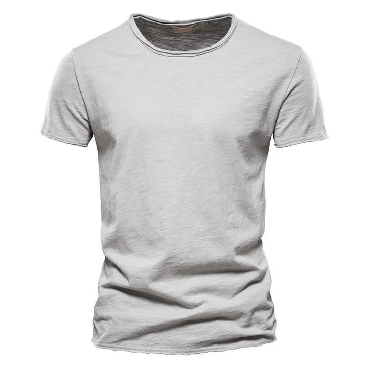 Grijs effen T-shirt voor heren, korte mouw, ronde hals. Modern en veelzijdig kledingstuk, perfect voor casual stijl. [[lstfy-media:4]]