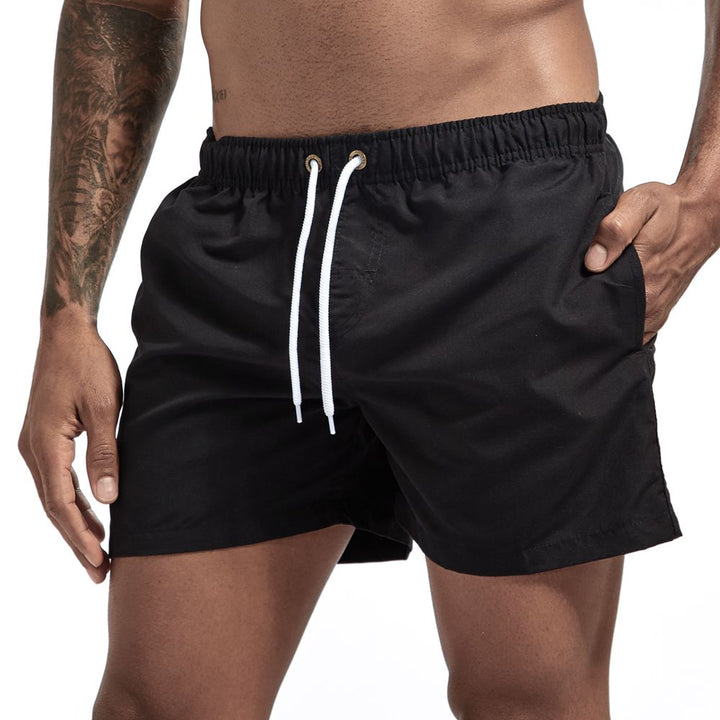 Praktische heren zwemshort met trekkoord en zijzakken; essentiële zwemkleding voor de man.