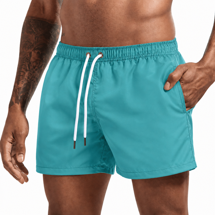 Veelzijdige heren zwembroek, korte zwemshort met trekkoord en praktische zijzakken. Zomer klaar.