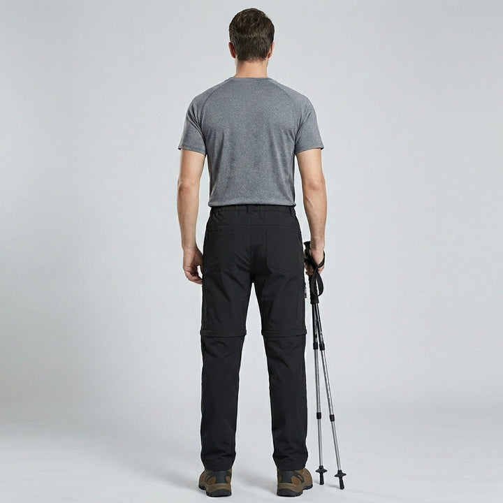 Legergroene heren outdoor afritsbroek, ideaal voor wandelen; snel om te zetten in shorts.