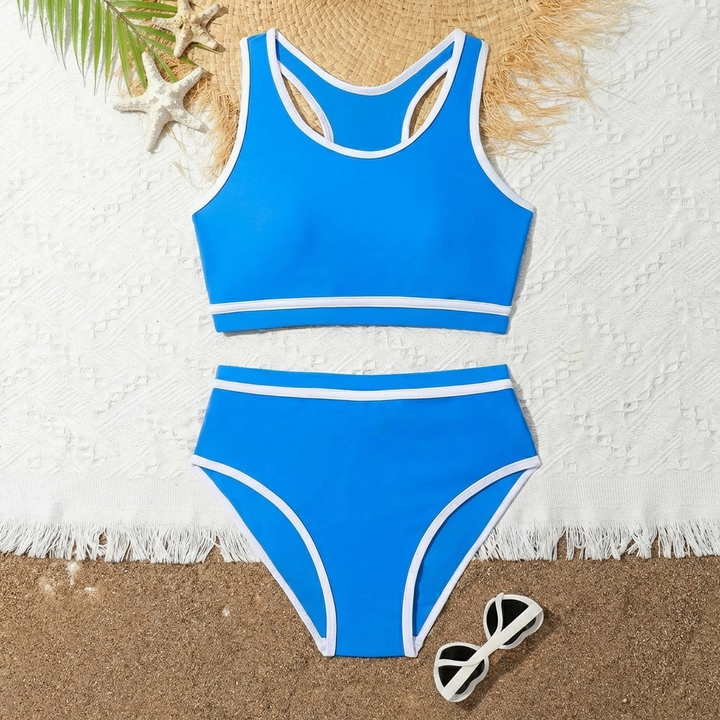 Stijlvolle meisjes zwemkleding bikiniset met contrasterende kleuren en gekruiste bandjes voor de zomer.