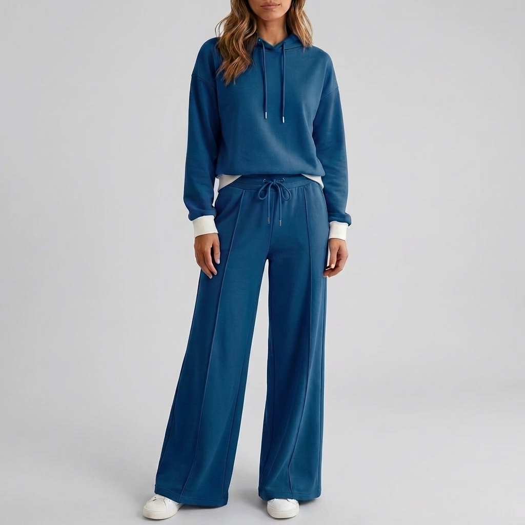 Tweedelige dames loungewear set met zachte cropped hoodie en relaxte broek. Comfortabel en modieus.