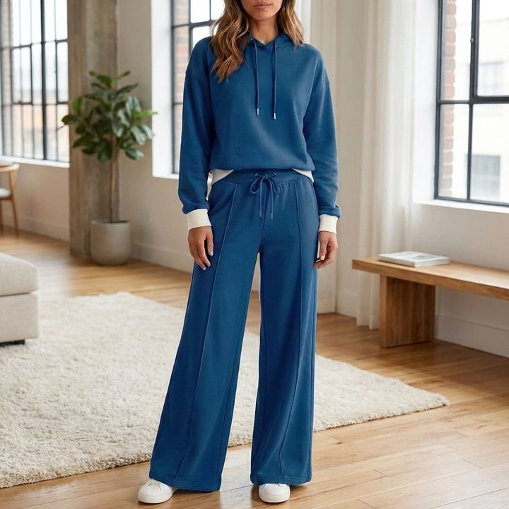 Dames relaxte tweedelige loungewear set met cropped hoodie en broek. Comfortabele vrijetijdskleding.