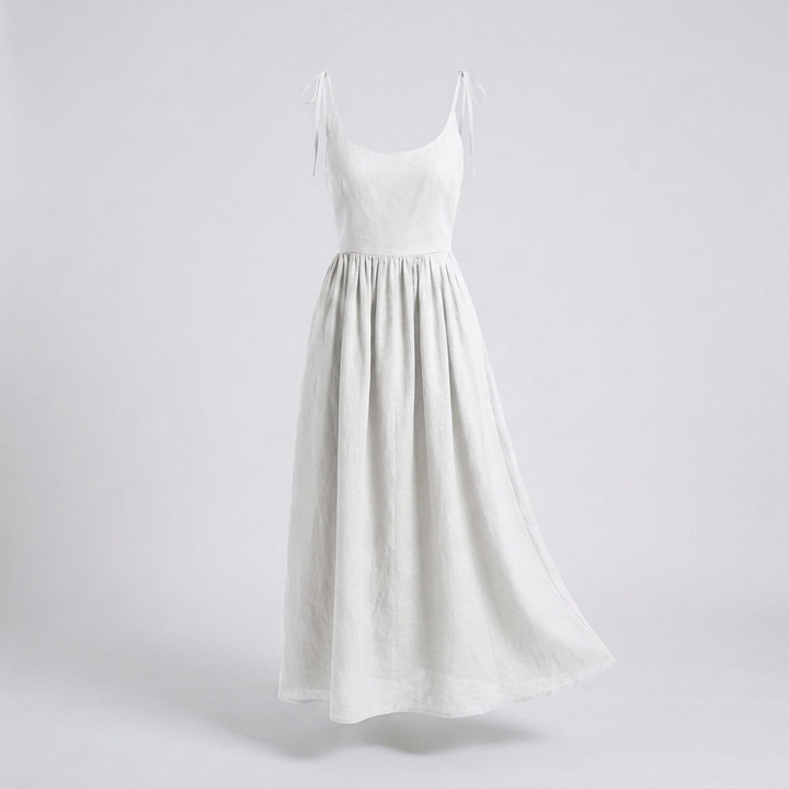 Veelzijdige damesjurk met strikbandjes, elegant en flatterend, geschikt voor diverse zomerse looks.