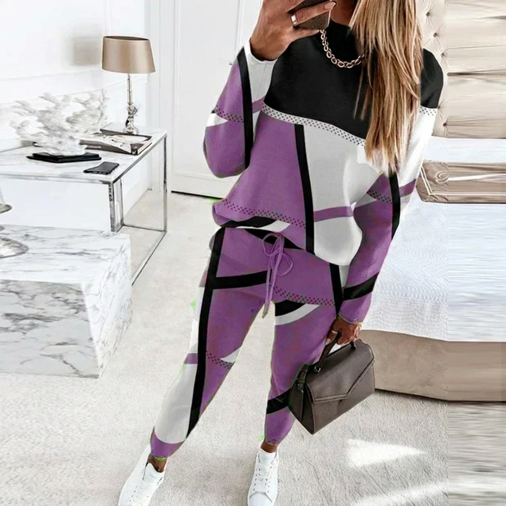 Modieuze dames tweedelige set: O-hals top en lange broek. Ideaal als vrijetijdskleding of comfortabele dagelijkse outfit.
