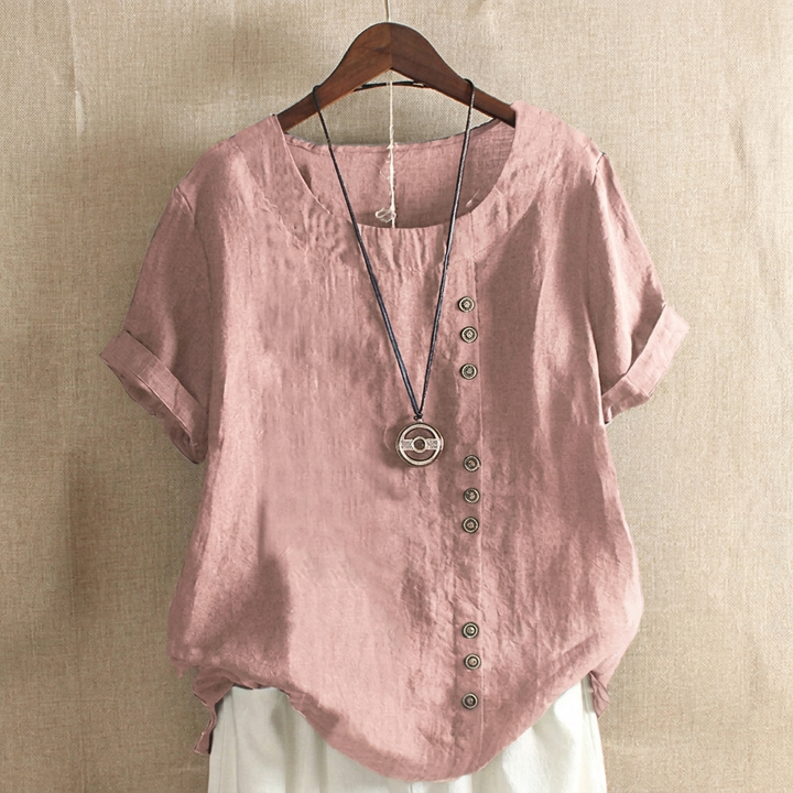 Elegante dames top met korte mouwen. Kenmerkende knoopdetails voegen een stijlvol accent toe aan deze comfortabele top.