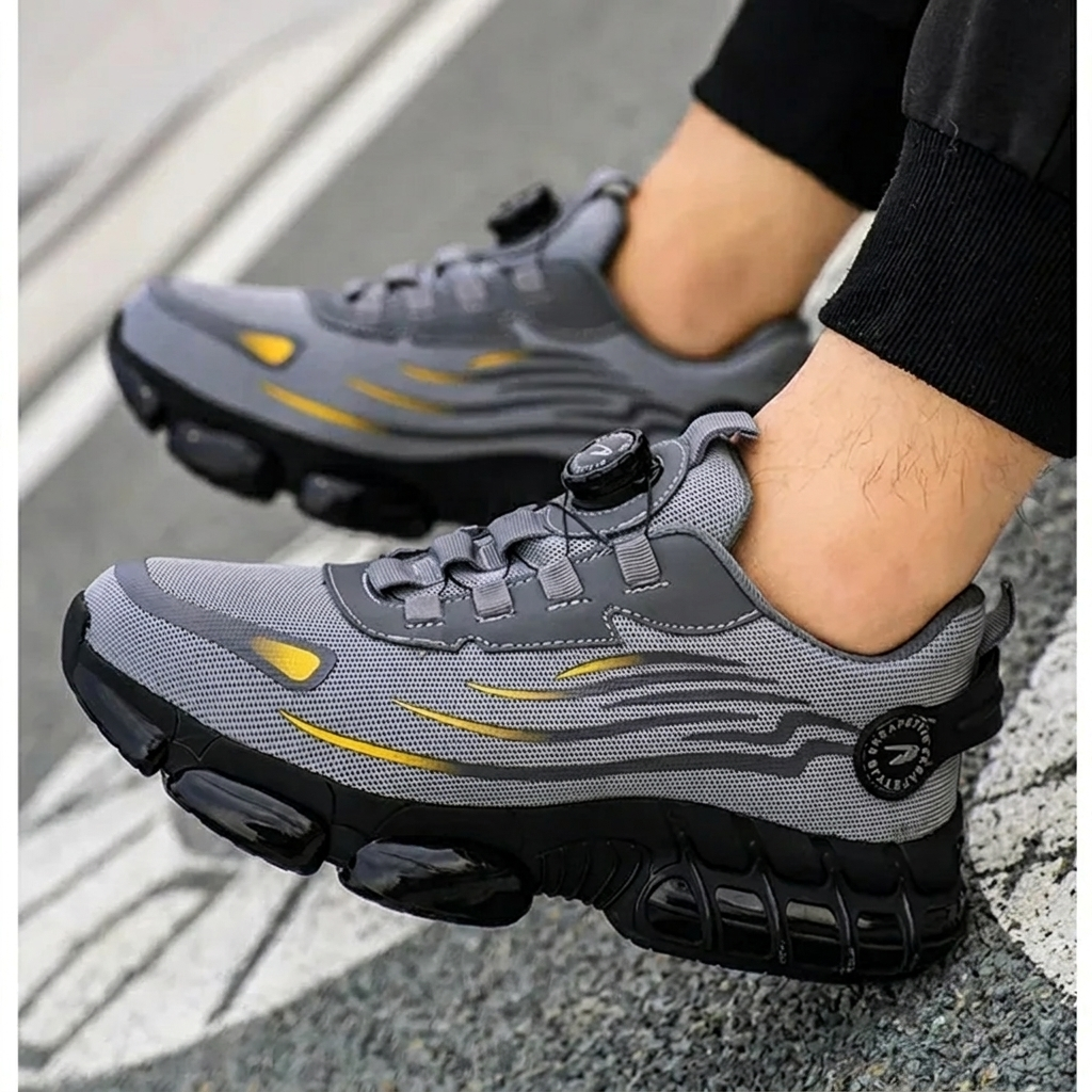 Robuuste grijze S3 werkschoenen voor dames en heren, met beschermende neus en antislipzool voor veilig werken.