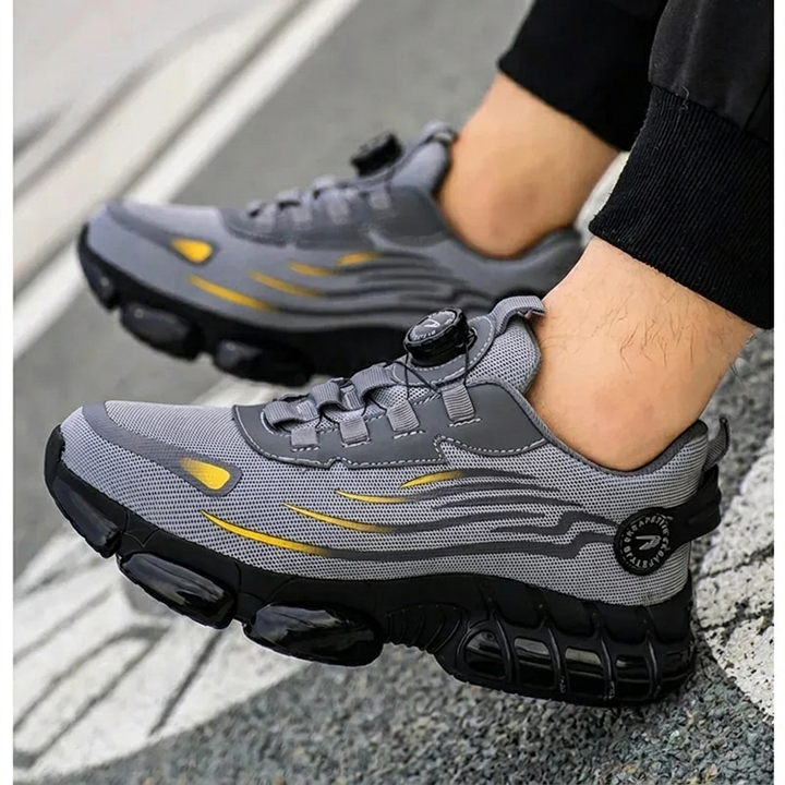 Robuuste grijze S3 werkschoenen voor dames en heren, met beschermende neus en antislipzool voor veilig werken.