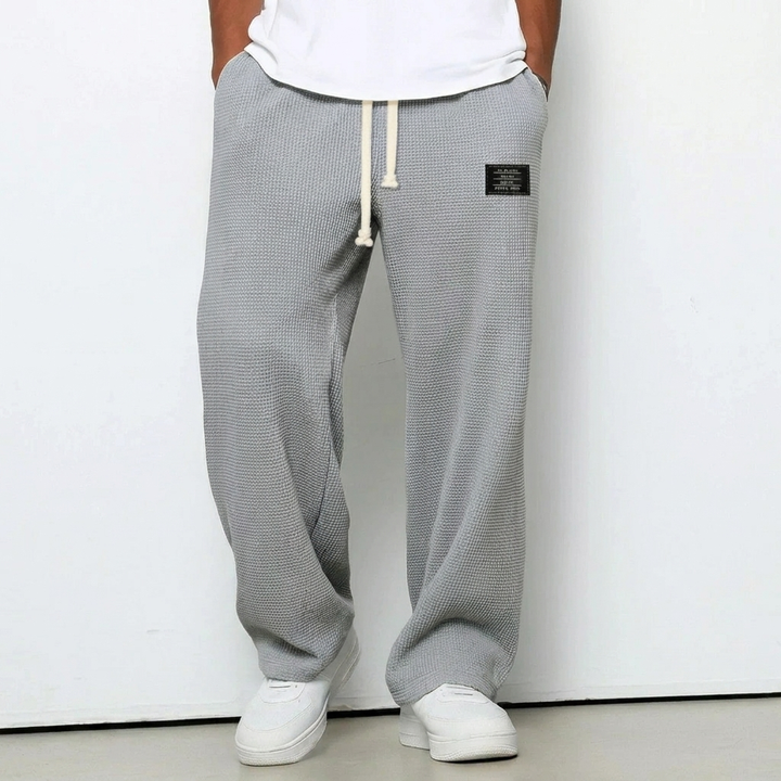 Casual herenbroek met losse pasvorm, grijs, perfect voor dagelijks gebruik en sportieve activiteiten.