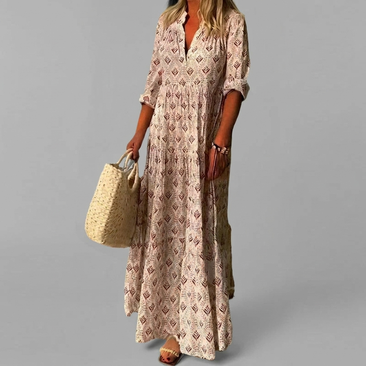 Elegante dames maxi-jurk met vloeiende vintage print. Comfortabele katoenmix, ideaal voor zomerse chic.