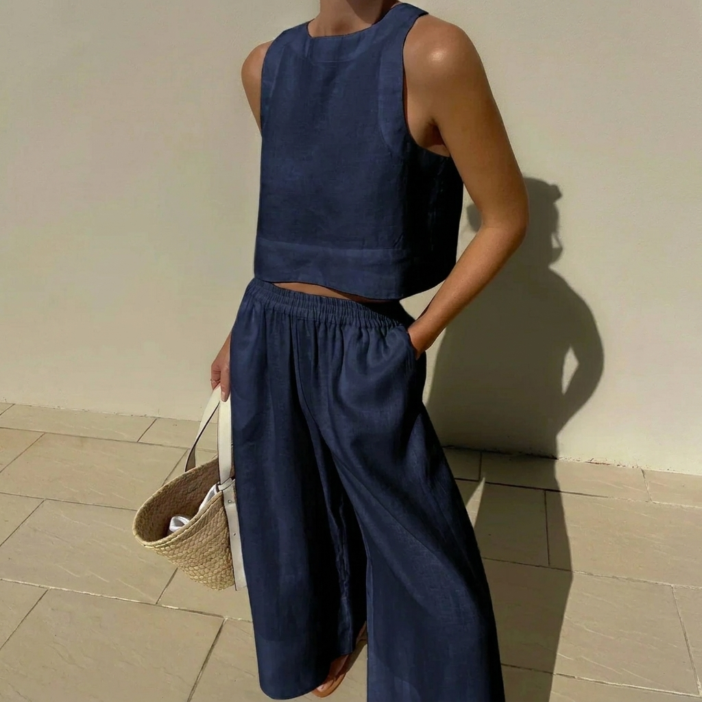 Chique dames outfit: trendy crop top en wijde broek, ideaal voor een elegante en ontspannen zomerlook.
