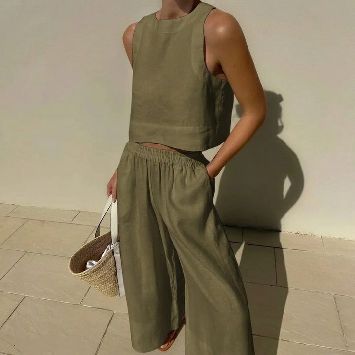 Elegante dames zomerset, inclusief een modieuze crop top en een comfortabele wijde broek voor een complete outfit.