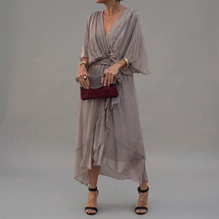 Comfortabele casual damesjurk met vleermuismouw, ideaal voor lente/zomer. Elegante asymmetrische pasvorm.
