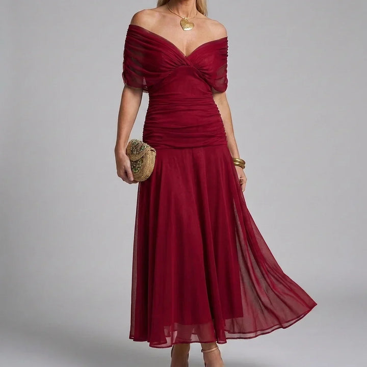 Lange dames maxi-jurk met V-hals, elegante A-lijn en zomerse print.