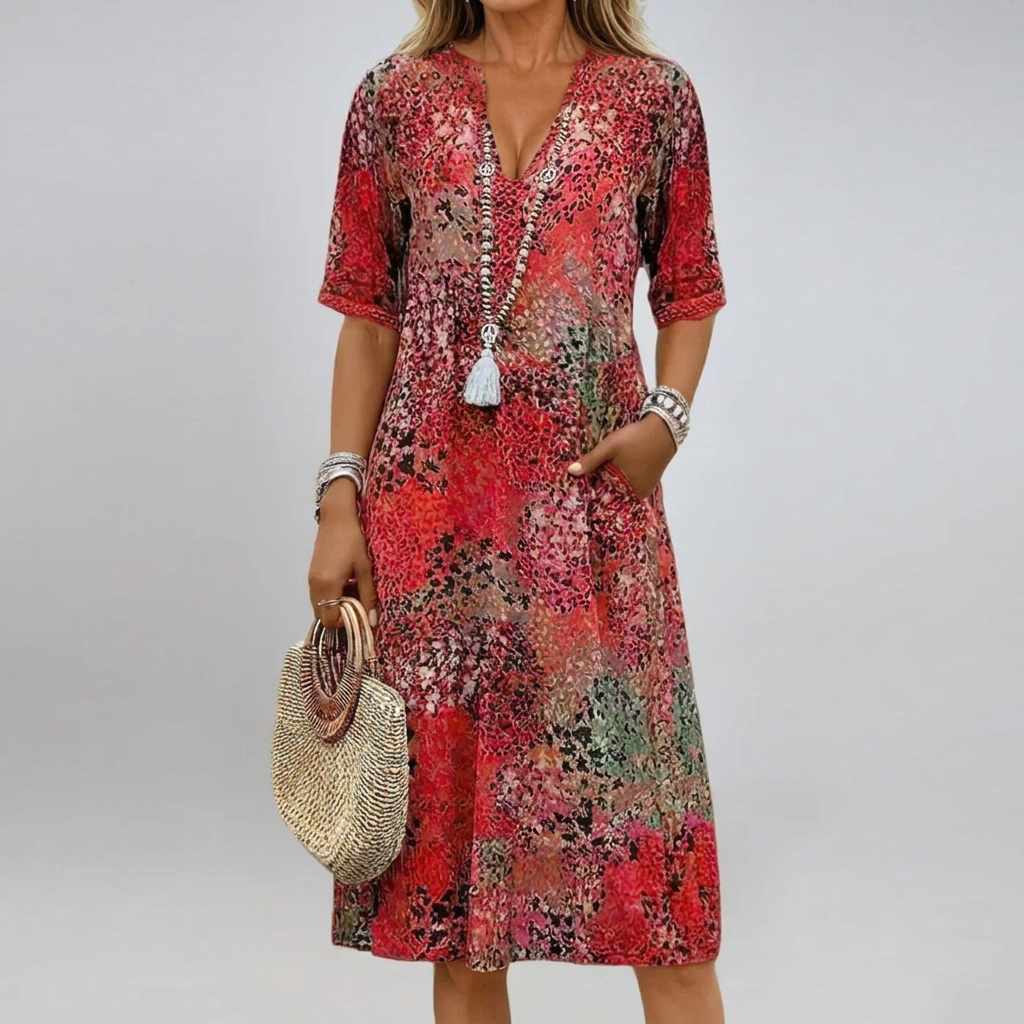 Elegante bedrukte v-halsjurk voor dames, met zakken. Ideaal als casual zomerjurk met losse pasvorm voor vakantie.