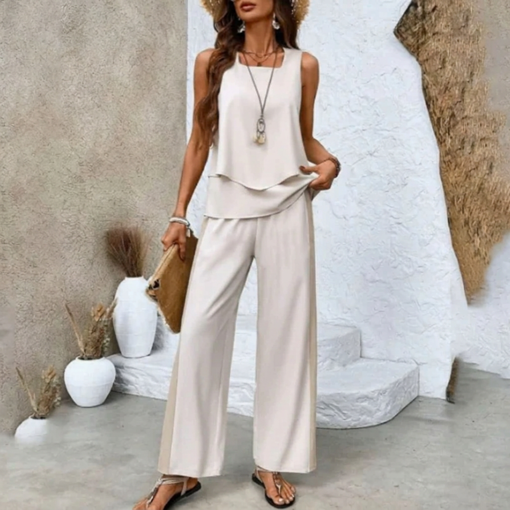 Gelaagde mouwloze top en soepele wijde broek uit dames zomer set, perfect voor warm weer en comfort.