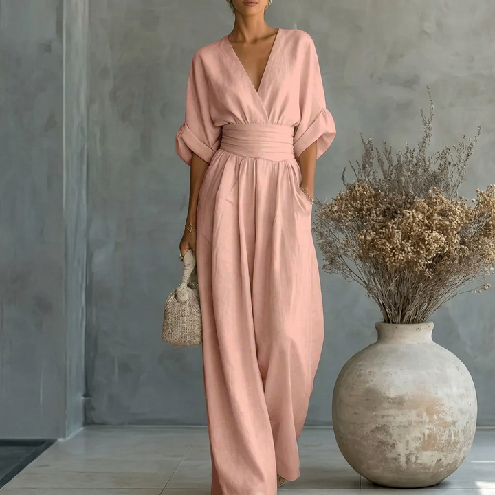Elegante dames jumpsuit met V-hals en wijde pijpen, veelzijdig voor zowel casual als feestelijke gelegenheden.