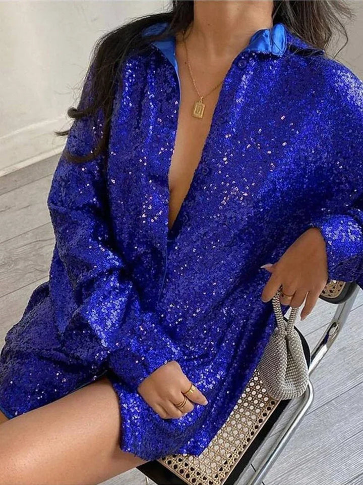 Sprankelende dames oversized blouse met prachtige glitterdetails, ideaal voor een trendy en feestelijke outfit.