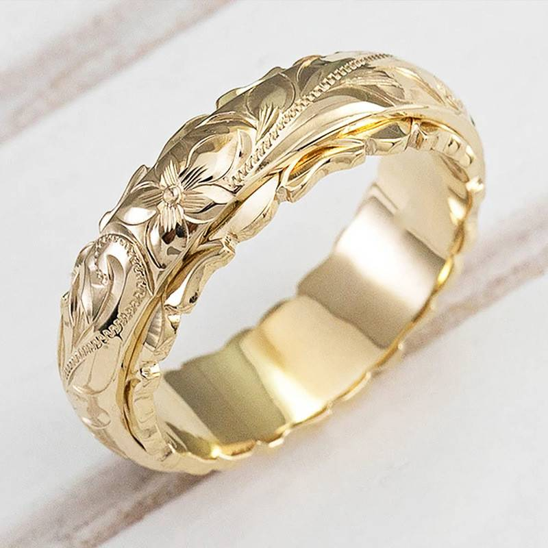 Elegante vintage gouden damesring Floriana met gedetailleerd bloemmotief. Tijdloos sieraad.