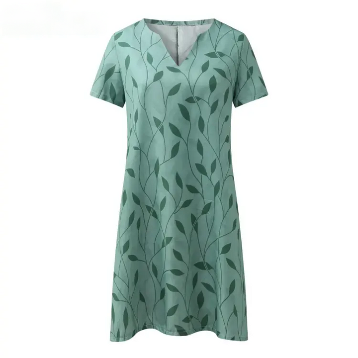 Groene damesjurk met V-hals en korte mouwen. Tijdloos en elegant, geschikt voor zomer, casual of feest.
