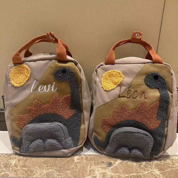 Unieke personaliseerbare dinosaurus rugzak voor kinderen, een leuke schooltas of praktische dagrugzak.