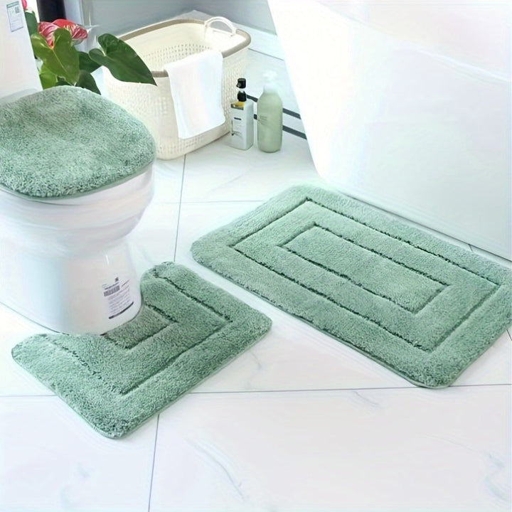 Detail van zachte, sneldrogende badmat met antislip onderkant. Comfortabel en wasbaar badkameraccessoire.