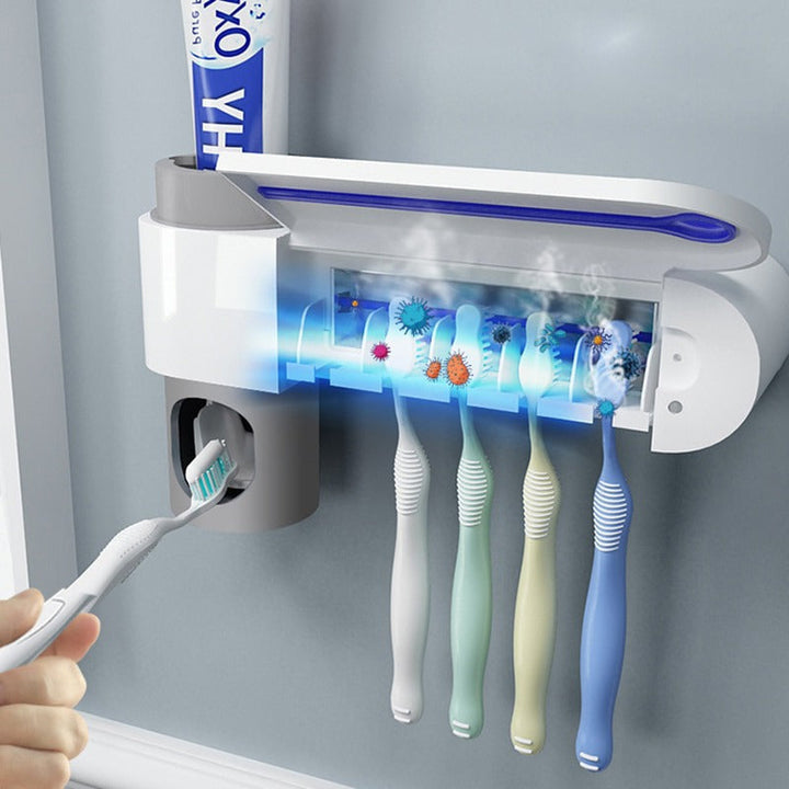 UV tandenborstelsterilisator en tandpasta dispenser voor hygiënische badkamer; doodt bacteriën effectief.