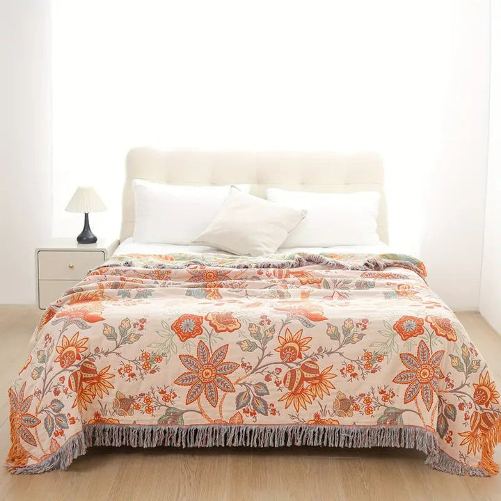 Stijlvol katoenen picknickkleed met bohemien franjes, ideaal voor buiten en interieurdecoratie.