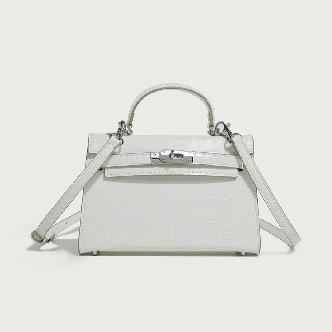 Stijlvolle zwarte veganleer schoudertas voor dames met subtiele textuur. Een elegante handtas of crossbody accessoire.