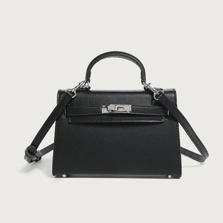 Witte veganleren dames schoudertas, elegant en veelzijdig. Te dragen als handtas of crossbody voor elke outfit.