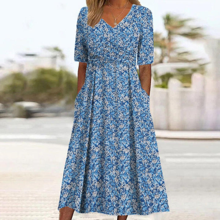 Stijlvolle dames midi jurk met V-hals, benadrukt vrouwelijkheid en comfort; een must-have voor je garderobe.