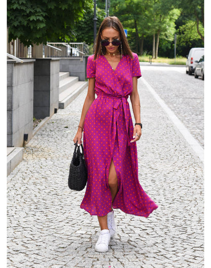 "Jade maxi jurk met levendige bloemenprint, V-hals en hoge split; ideale zomerse damesjurk voor strand of feest."