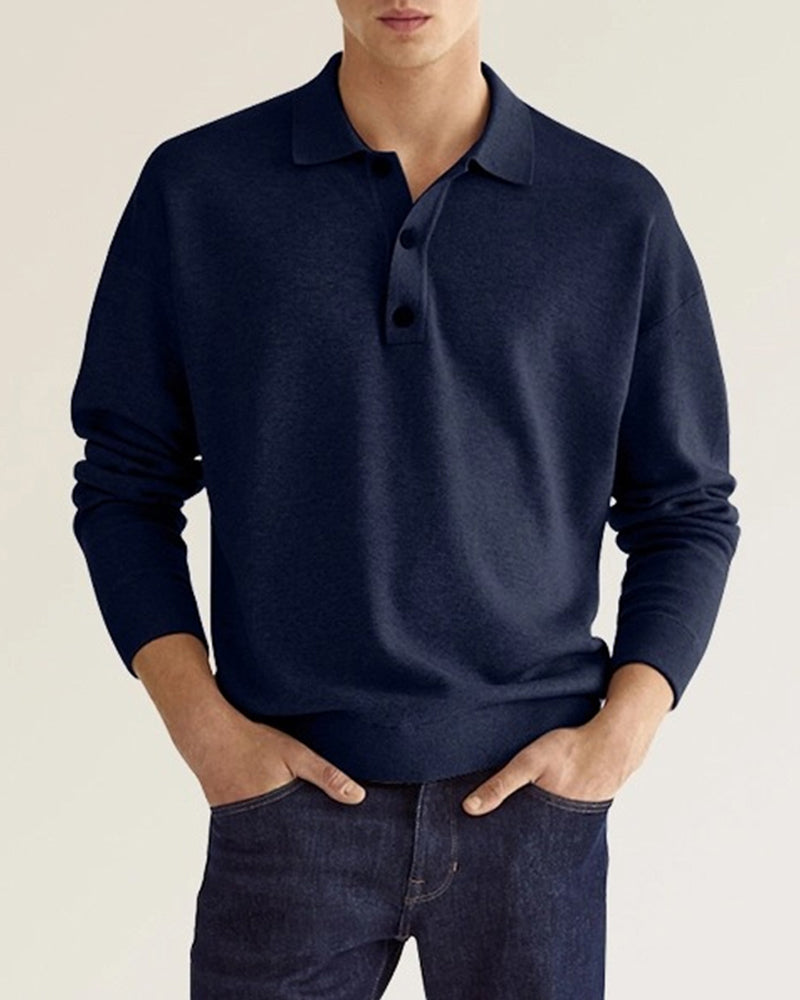 Mannelijke herenpolo met lange mouwen en knoopsluiting. Een effen, tijdloos design voor veelzijdige herenmode.