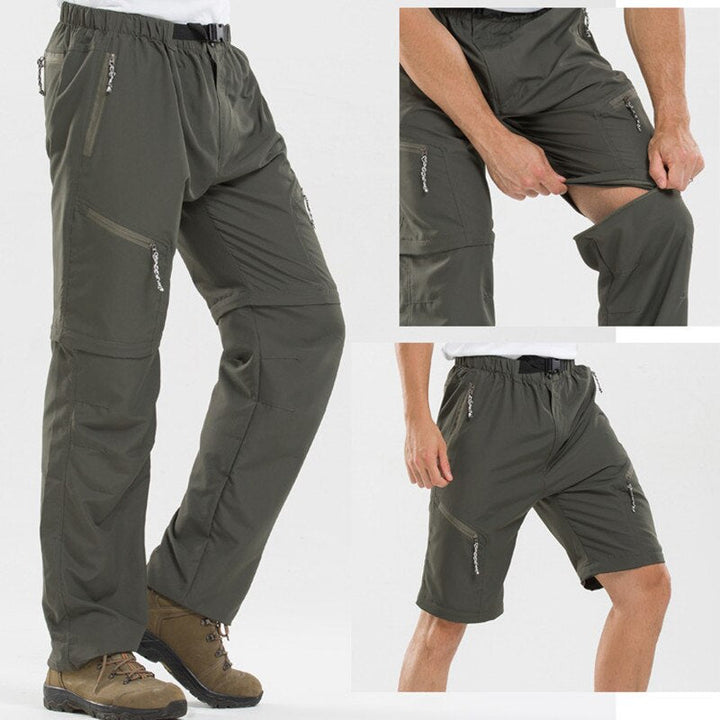 Man draagt zwarte afritsbroek voor heren. Ideaal voor outdoor avonturen. Comfortabel en functioneel.
