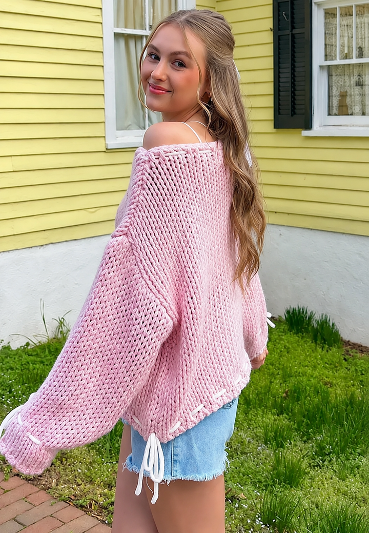Stijlvolle dames trui met boothals en delicate strikdetails, een comfortabele keuze voor elke gelegenheid.