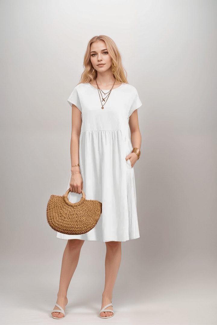 Midi jurk dames; A-lijn model met korte mouwen en praktische zakken, een comfortabele en tijdloze toevoeging aan je garderobe.