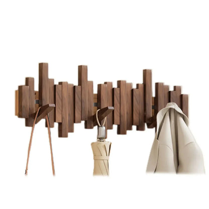 Kapstok Piano van walnoot en beukenhout, stijlvolle houder voor jassen en accessoires in een elegant interieurontwerp.