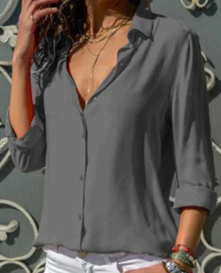 Stijlvolle getailleerde damesblouse met knoopsluiting, ideaal voor zowel zakelijke als casual combinaties.