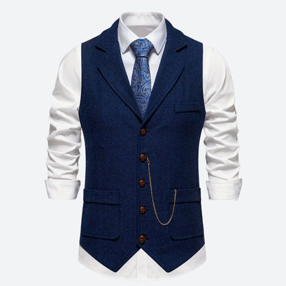 "Klassiek herengilet met visgraatmotief, stijlvol en tijdloos, ideaal voor formele en zakelijke gelegenheden."
