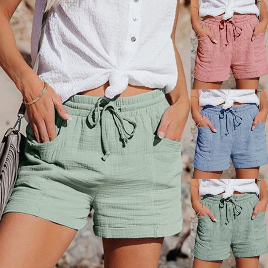 "Korte ademende katoenen dames shorts met verstelbare tailleband en zakken in diverse kleuren, ideaal voor de zomer."