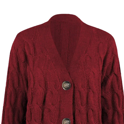 "Lange gebreide damescardigan in zachte stof met knoopsluiting en zakken, ideaal voor casual lente looks."