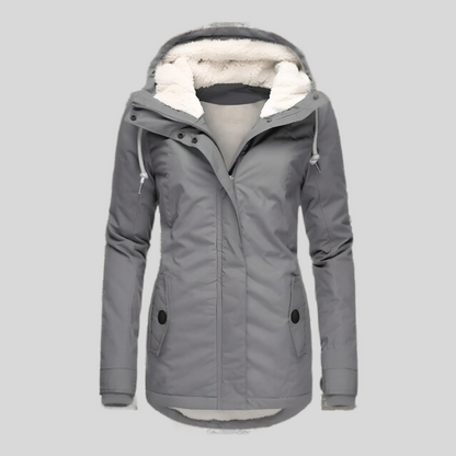 "Lange winterjas, waterdicht, met capuchon en zachte voering voor dames, biedt style en bescherming voor koud weer."