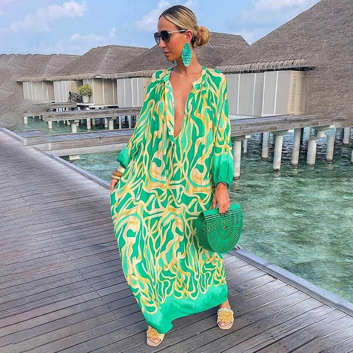 Dames maxi jurk met lange mouwen en levendige bohemian print, ideaal voor zomerse dagen.