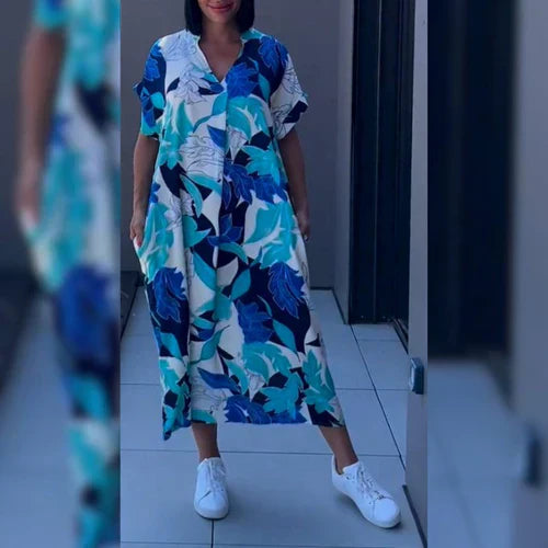 "Levendige bedrukte kaftan maxi jurk met tropisch dessin, V-hals en korte mouwen, ideaal voor zomerse dagen en avonden."