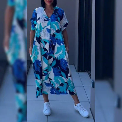 "Levendige bedrukte kaftan maxi jurk met tropisch dessin, V-hals en korte mouwen, ideaal voor zomerse dagen en avonden."