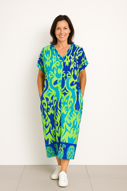 "Levendige bedrukte kaftan maxi jurk met tropisch dessin, V-hals en korte mouwen, ideaal voor zomerse dagen en avonden."