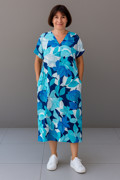 "Levendige bedrukte kaftan maxi jurk met tropisch dessin, V-hals en korte mouwen, ideaal voor zomerse dagen en avonden."