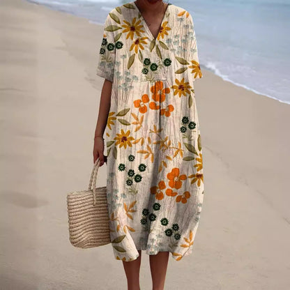 Lotte zomerjurk met bloemenprint en V-hals, elegante en luchtige damesjurk die comfort en stijl biedt voor zomerse dagen.
