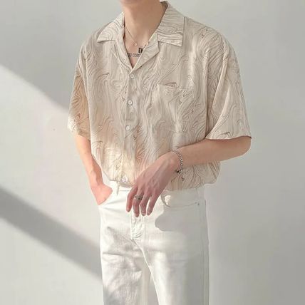 Grijs heren overhemd korte mouw, oversized en modern. Ideaal voor een comfortabele casual zomerse herenmode outfit.